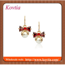 Red crystal bowknot and small pearl dangle earring plated 18k gold